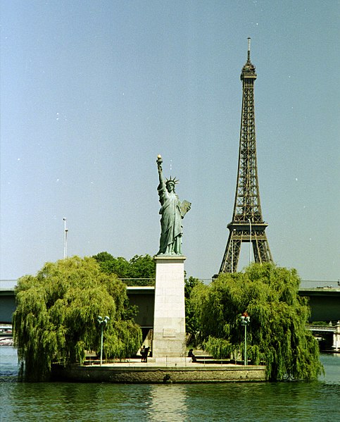 The Statue of Liberty on the Île aux Cygnes, with the Eiffel Tower in the background