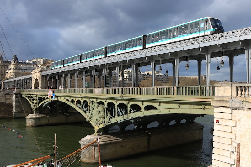The Art Nouveau bridge of Bir Hakeim, with a walk-through train passing over it