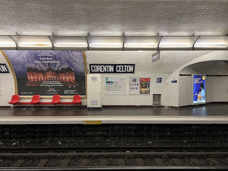 Metro station platform with tiles showing name CORENTIN CELTON
