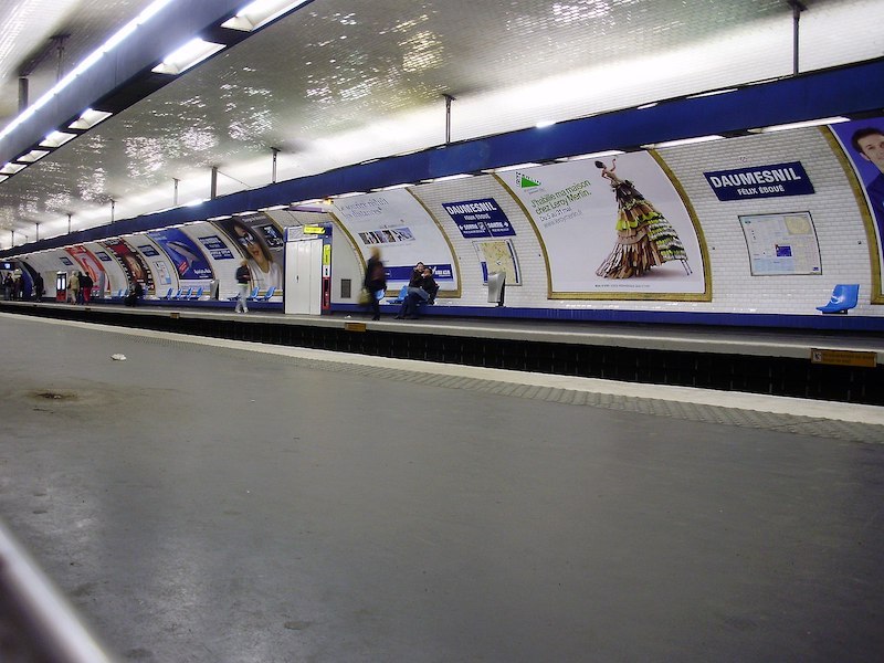 Metro station platforms. Signs read DAUMESNIL, with the subtitle FÉLIX ÉBOUÉ