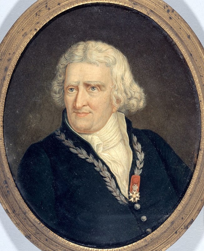 Portrait of a man with medium-length white hair