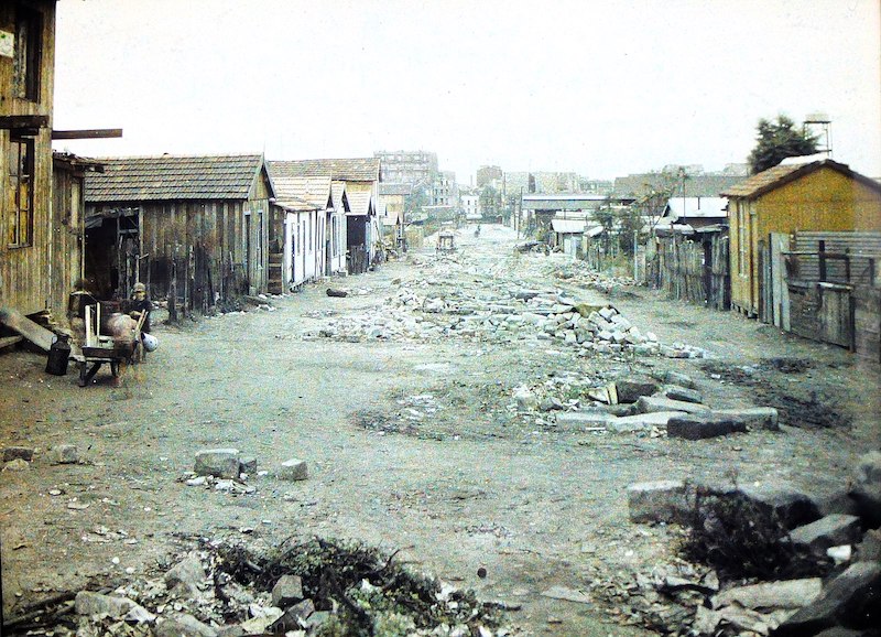 Colour photograph of a drab slum landscape