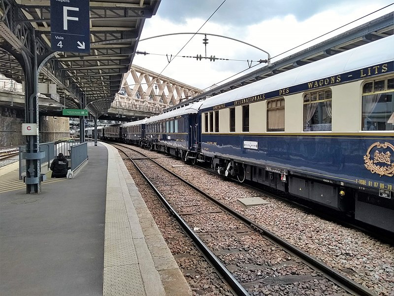 A Venice Simplon-Orient-Express train at the Gare de l'Est, with coaches under the Pont La Fayette