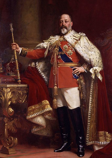 Man with grey beard in red coronation robes