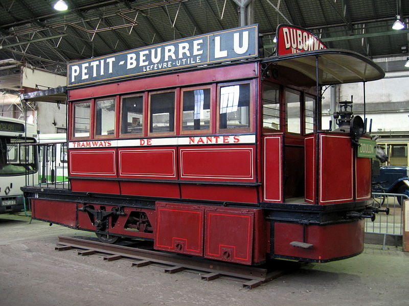 A red and black tram labelled TRAMWAYS DE NANTES