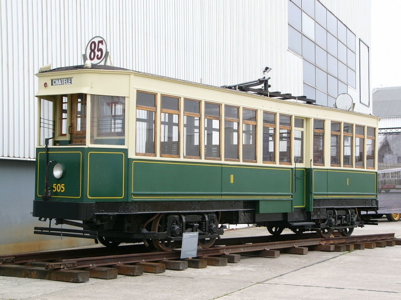 Green and cream tram, labelled 85 CHATELET