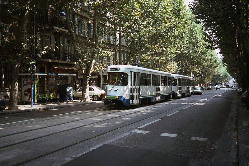 Tram composed of two white coaches, coupled but not walk-through, headed for Noailles on line 68